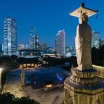 Photo by junmichaelpark  A large statue of Buddha at Bongeunsa temple overlooks a commercial distri...