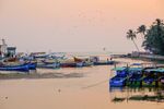 Photo by francescolastrucci  The sun sets over the beach of Baga where the freshwater of the river ...