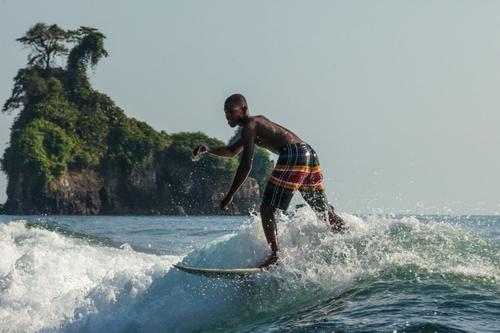 Photo by juancristobalcobo  A surfer rides the wa